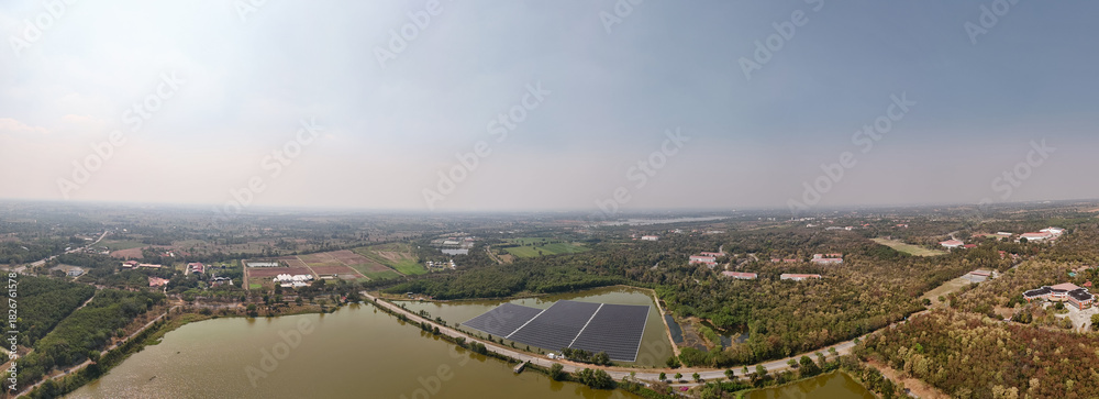 Fototapeta premium Professional workers clean and inspect solar panels on a floating buoy. Power plant with water 