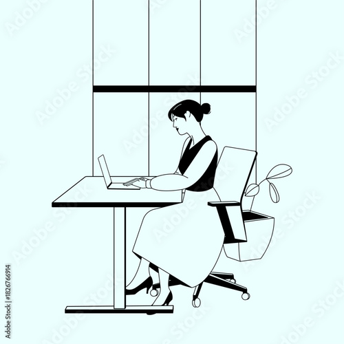 Woman Working on Laptop at Office Desk
