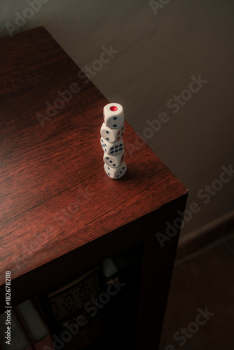 White dices on wood surface. Pile of game cubes for risk and gamble concept.