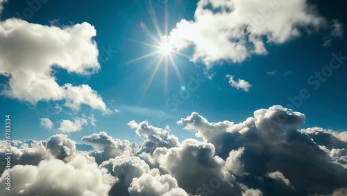 Fast motion 4K timelapse of bright white puffy clouds moving across a sunny blue sky capturing dynamic natural cloud formations perfect for atmospheric environmental or background stock footage