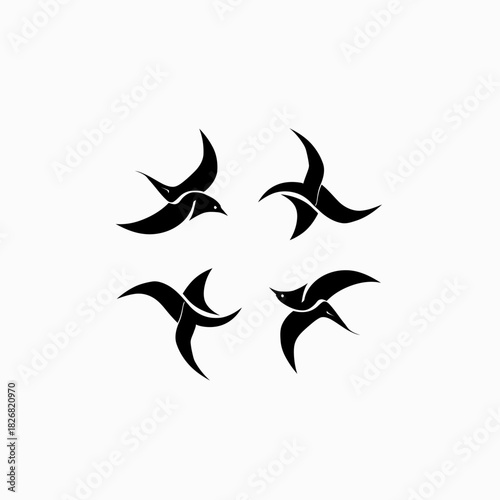 Collection of minimalist black bird silhouettes in flight, abstract swift or swallow flying icon set, graphic design elements