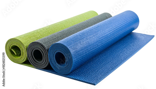 Three rolled exercise mats in different colors against a black backdrop, partially unrolled