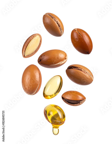 Wallpaper Mural Argun Nuts and Oil with Green Leaves - Transparent Background - Cracked open nuts Falling - Food Image for Health and Beauty - Raw Food and Cosmetic Ingredient - Hair Shampoo and Vitamin Benefits Torontodigital.ca