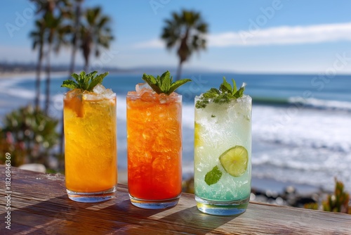 Refreshing Drinks on a Wooden Table by the Beach With Ocean Waves in the Back...