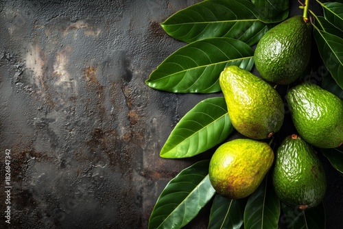 Fresh Avocados Arranged With Green Leaves on Dark Surface in a Vibrant Kitche...