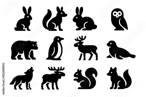 Snow Wildlife Icons. Snow-adapted wildlife. Solid icon set of Snow-adapted wildlife: snow hare, fox, rabbit, owl, polar bear, penguin, reindeer, seal, wolf,