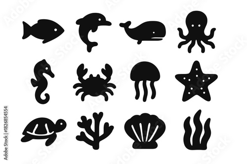 Marine Icons Collection. Ocean Wildlife. Solid icon set of fish, dolphin, whale, octopus, seahorse, crab, jellyfish, starfish, turtle, coral, shell, seaweed.