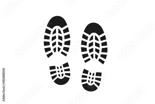Detailed pair of black boot sole prints showing rugged tread pattern isolated on white background
