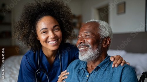 Older man sitting in bed with nurse standing beside him.