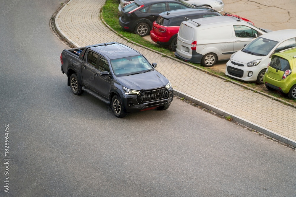 Fototapeta premium Gray utility vehicle on roadside