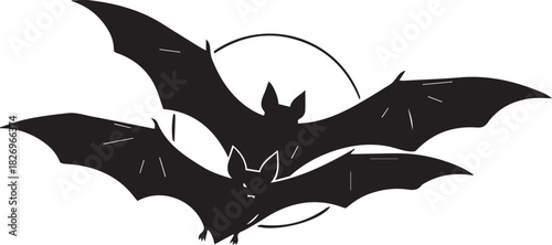 Spooky silhouettes of two bats flying across a full moon for halloween celebrations