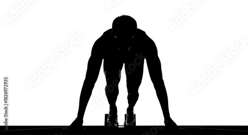 Silhouette of Athlete in Starting Position Ready to Sprint on the Track with Determination and Focus