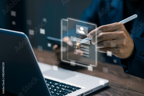 A digital resume interface floating above a laptop as a person interacts with it, representing online recruitment, HR technology, candidate evaluation, and modern hiring processes.