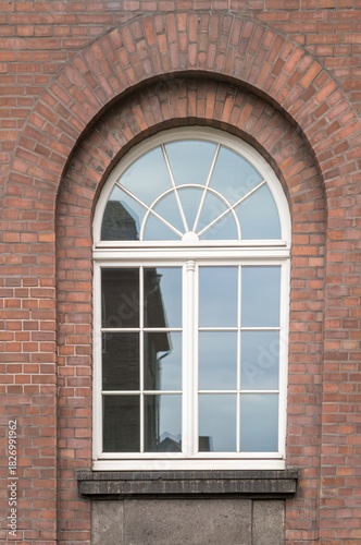 Large mullioned window on a 100-year-old building