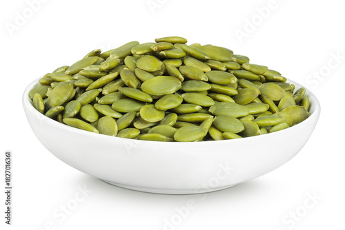 Peeled pumpkin seeds in ceramic bowl isolated on white background