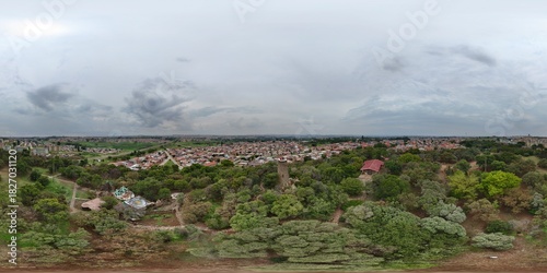360 aerial photo taken with drone of Credo Mutwa Cultural Village on overcast day in Soweto, Johannesburg, South Africa