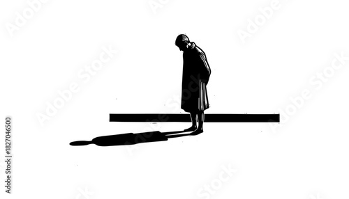 Solitary silhouette of woman standing at edge casting long shadow