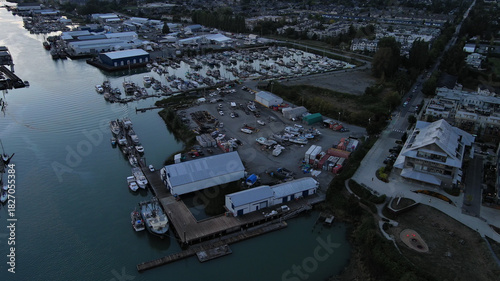 Aerial view of marina and buildings below