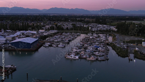 Aerial view of marina and buildings below
