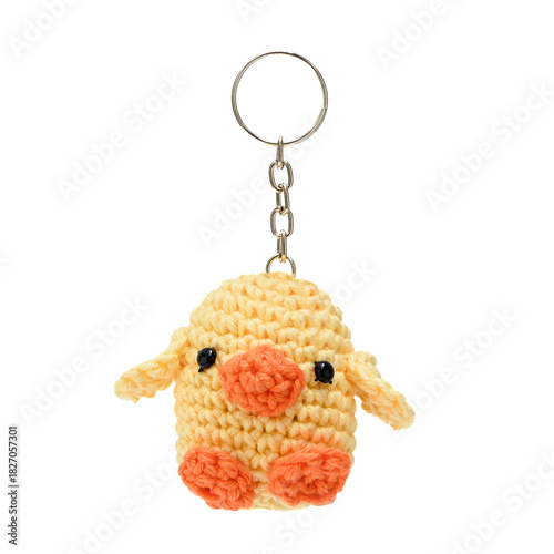 Plush duck keychain made using the amigurumi technique in yellow and orange colors on a transparent background.