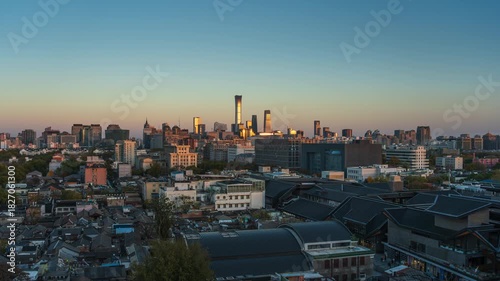 Time-lapse footage of Beijing, China, transitioning from day to night, showing hutongs to the central business district and the contrast between old and new city areas