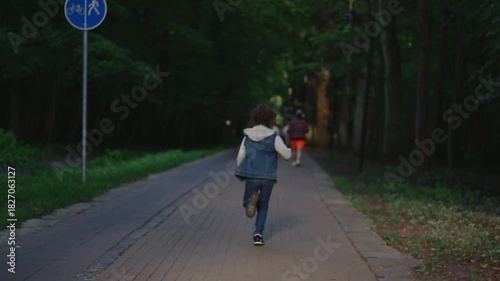 Wallpaper Mural Caucasian teenage boy running on a warm spring day. Childhood energy concept Torontodigital.ca