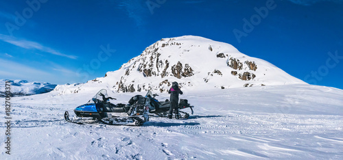 Arctic snowmobiling adventure exploring Lapland mountains