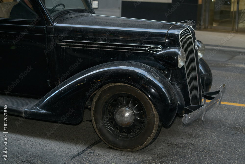 Fototapeta premium vintage automobile on a film set along Bay St, Toronto