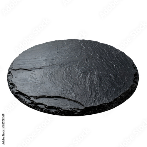 A dark, round slate serving platter set against a stark black background.