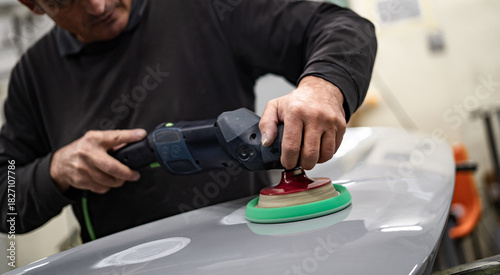 Industrial workshop with the metal frame construction of a bus or RV. Large vehicle chassis in fabrication, showcasing manufacturing, engineering, and assembly environment.