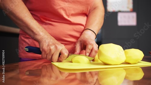 Preparing fresh ingredients for a healthy meal at home while chopping vegetables in the kitchen