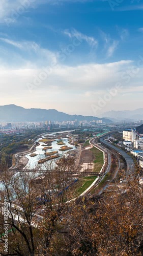 Beijing Yongding River urban industrial heritage with distant mountain scenery — time-lapse footage