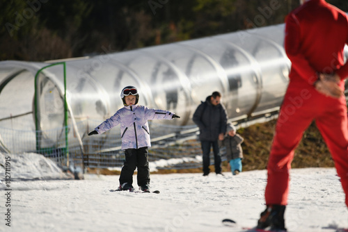 Ski coach giving a lesson to a child
