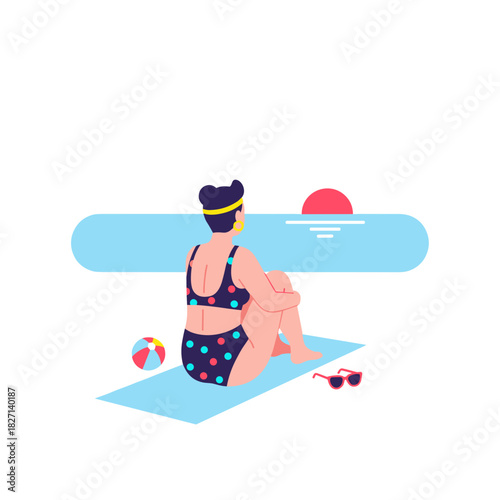 Non-binary person sitting on beach towel watching sunset on beach  