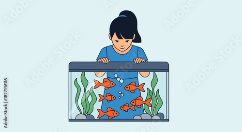 Young girl with a ponytail watching goldfish in a home aquarium.
