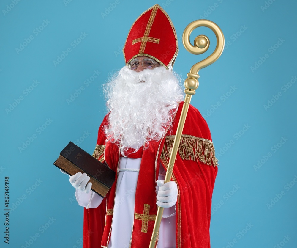 Fototapeta premium Saint Nicholas with book and crozier on blue background