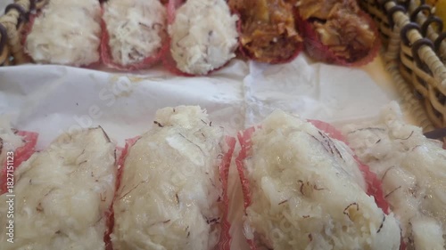 Cocadas on a wooden tray, traditional Brazilian sweet made with coconut.
