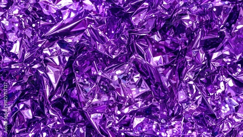 Violet crumpled aluminum foil with shiny and reflective surfaces. Textured background showing metallic shine and irregular folds. Abstract metallic crumpled foil.