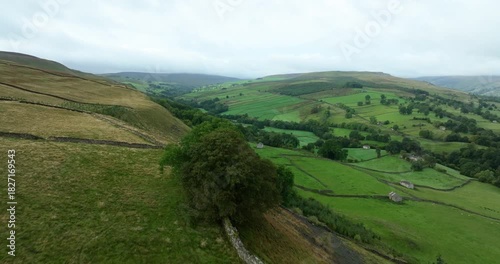 Flying over green valley in Yorkshire Dales