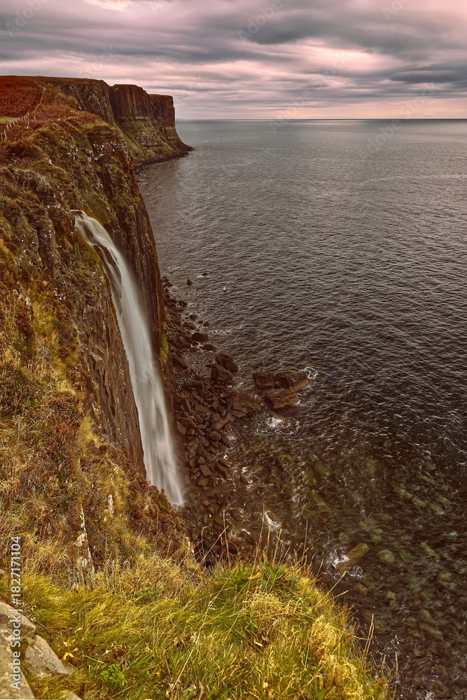 Fototapeta premium Loch Mealt falls, 55m plunge onto the seashore just south of the 90m Kilt Rock (Creag an Fhèilidh) wall facing Raasay Sound. Isle of Skye-Scotland-113