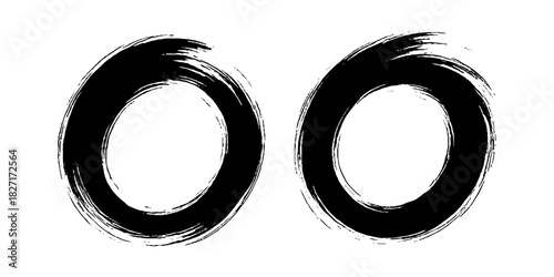 Two bold black ink circles painted with dynamic brush strokes, minimalist Japanese sumi-e style, clean background.