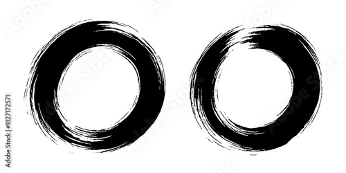 Two bold black ink circles painted with dynamic brush strokes, minimalist Japanese sumi-e style, clean background.
