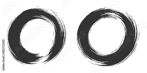 Two bold black ink circles painted with dynamic brush strokes, minimalist Japanese sumi-e style, clean background.