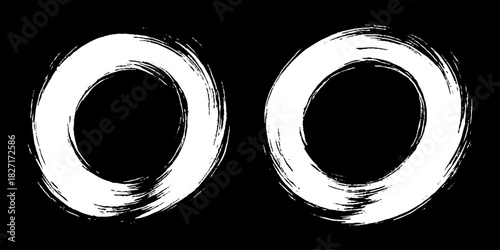 Two bold black ink circles painted with dynamic brush strokes, minimalist Japanese sumi-e style, clean background.