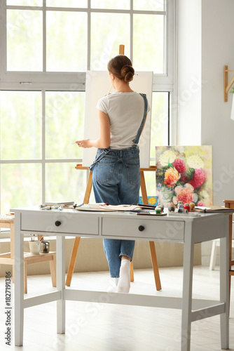 Female artist painting pict...