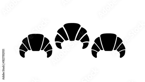Vector illustration of three black silhouette icons of croissant pastry isolated on transparent background for food design
