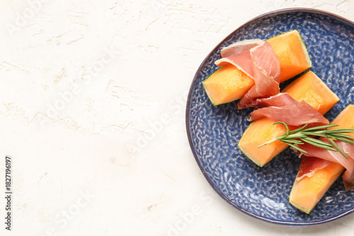 Plate with tasty melon and ...