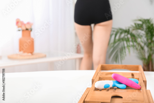 Vibrators on bathtub in roo...