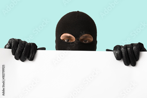 Male thief with blank poste...