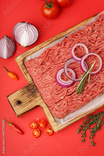 Wooden board of fresh mince...
